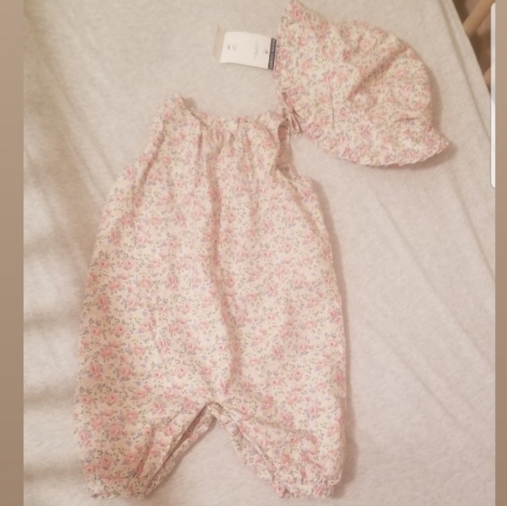Floral romper and sun hat.